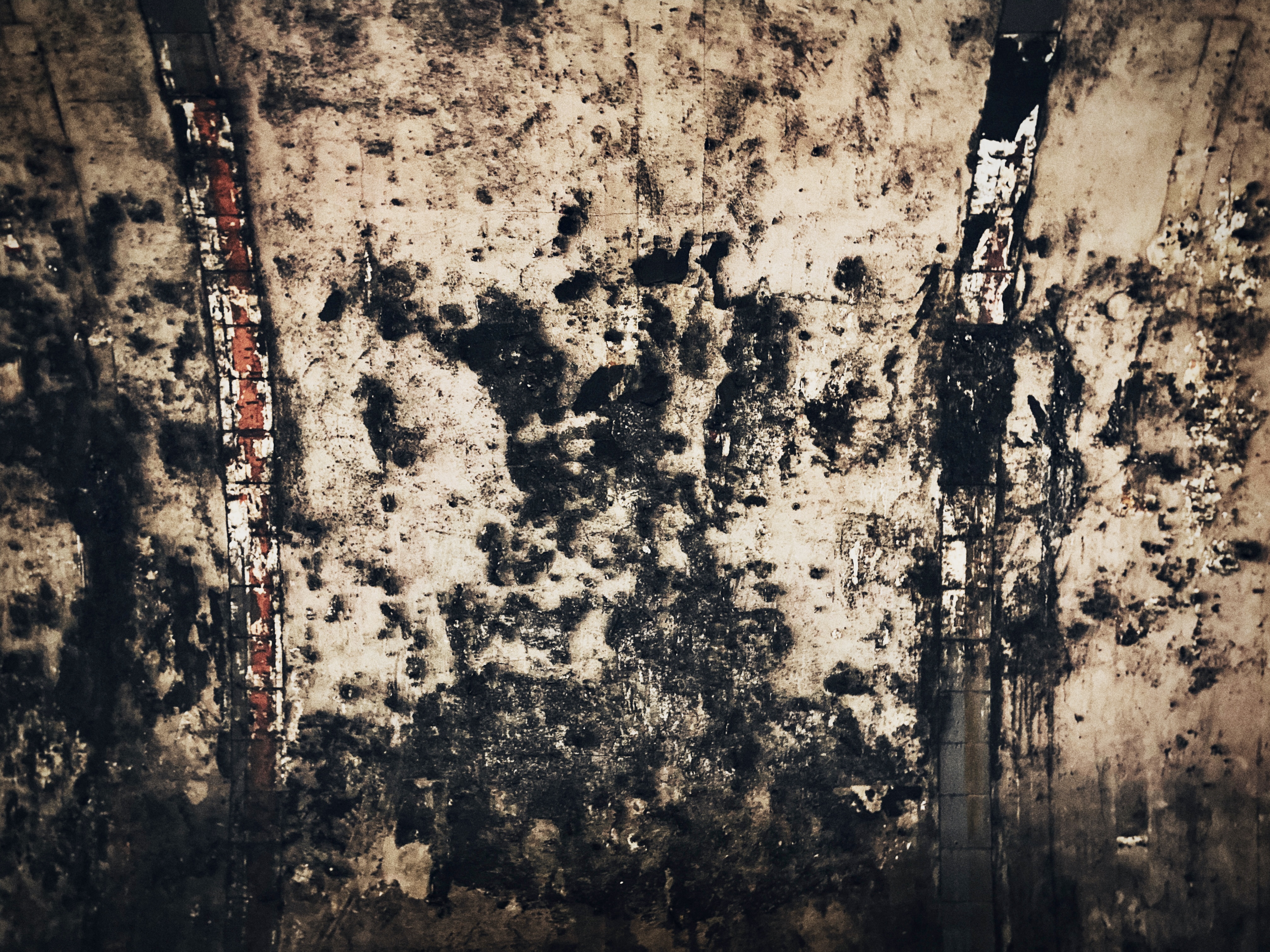 An abstract photograph featuring intersecting lines and shadows, evoking themes of territory and mapping.