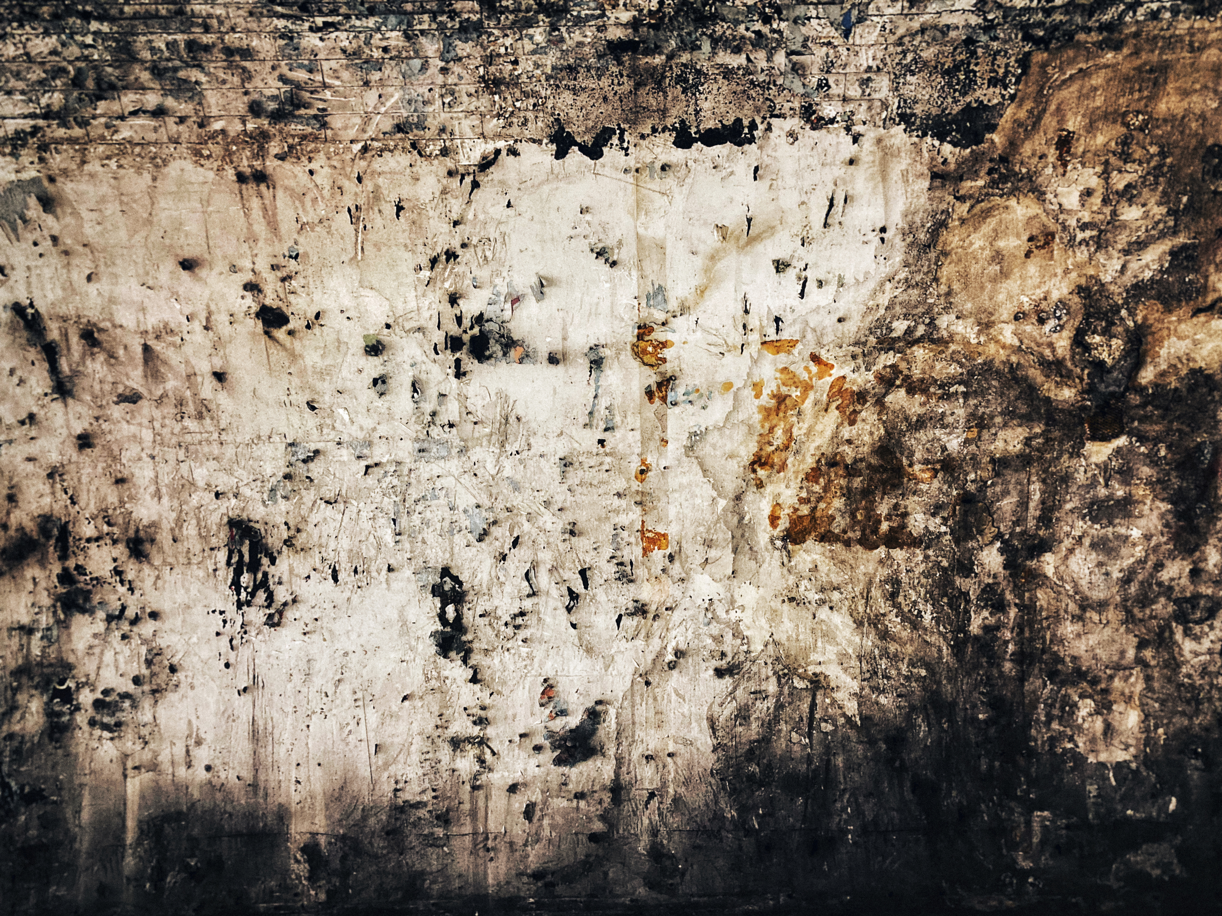 A moody, atmospheric image with layered textures and subtle lighting, suggesting a subterranean environment